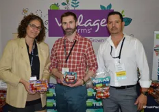 Lyra Vance, Brandon Jamison and Carlos Flores with Village Farms. Lyra shows chameleon tomato packaging. Brandon and Carlos show Texas-grown tomatoes with the packaging emphasizing the company’s Texas program.